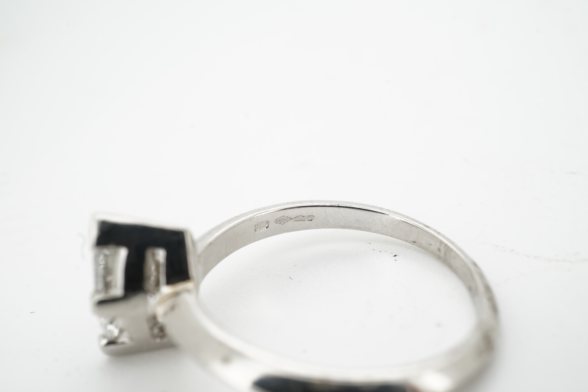 A diamond ring, claw-set with a marquise-shaped diamond weighing approximately 0.50 carats, mounted in platinum, size L, British hallmarks, gross weight approximately 4 grams